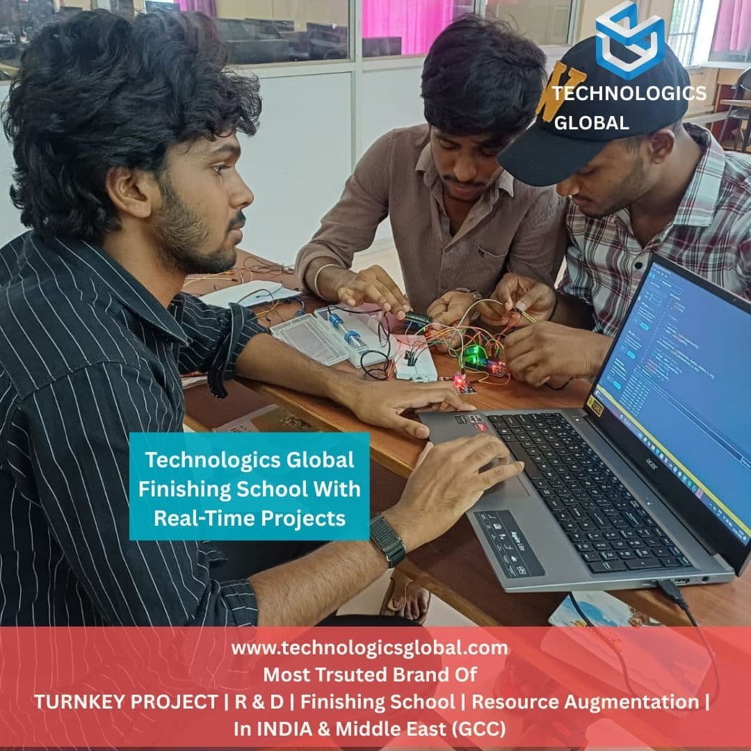 Three Technologics Global finishing school candidates wiring a sensor circuit and debugging the firmware on a laptop