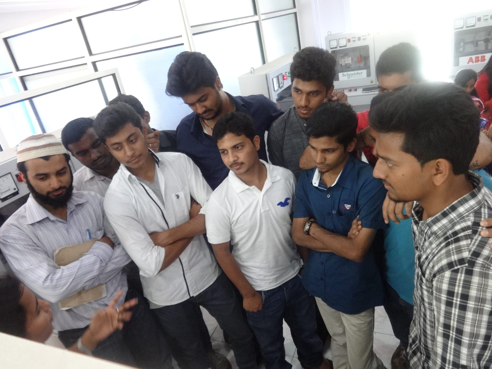 Technologics Global instructor training students on PLC and SCADA in the automation lab