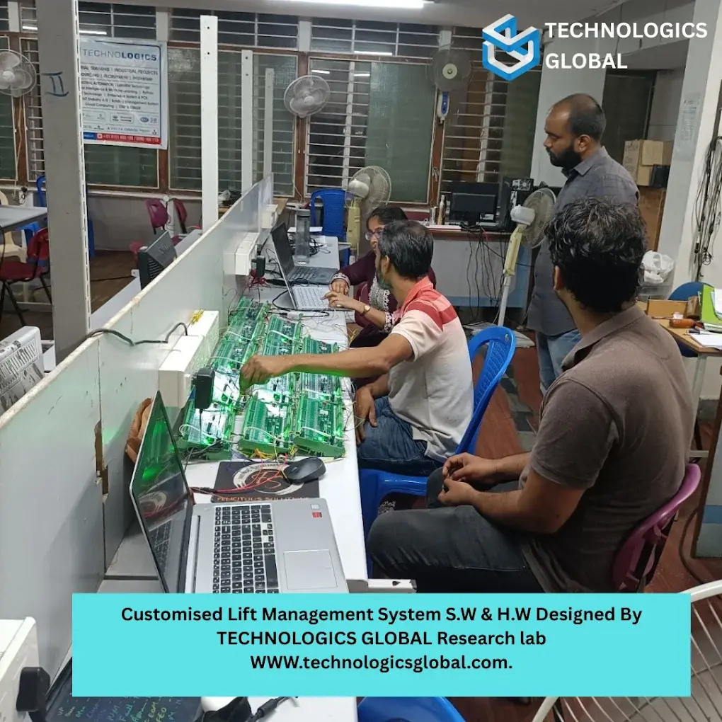 Technologics Global engineers bench-testing the customised lift management system boards designed by the research lab