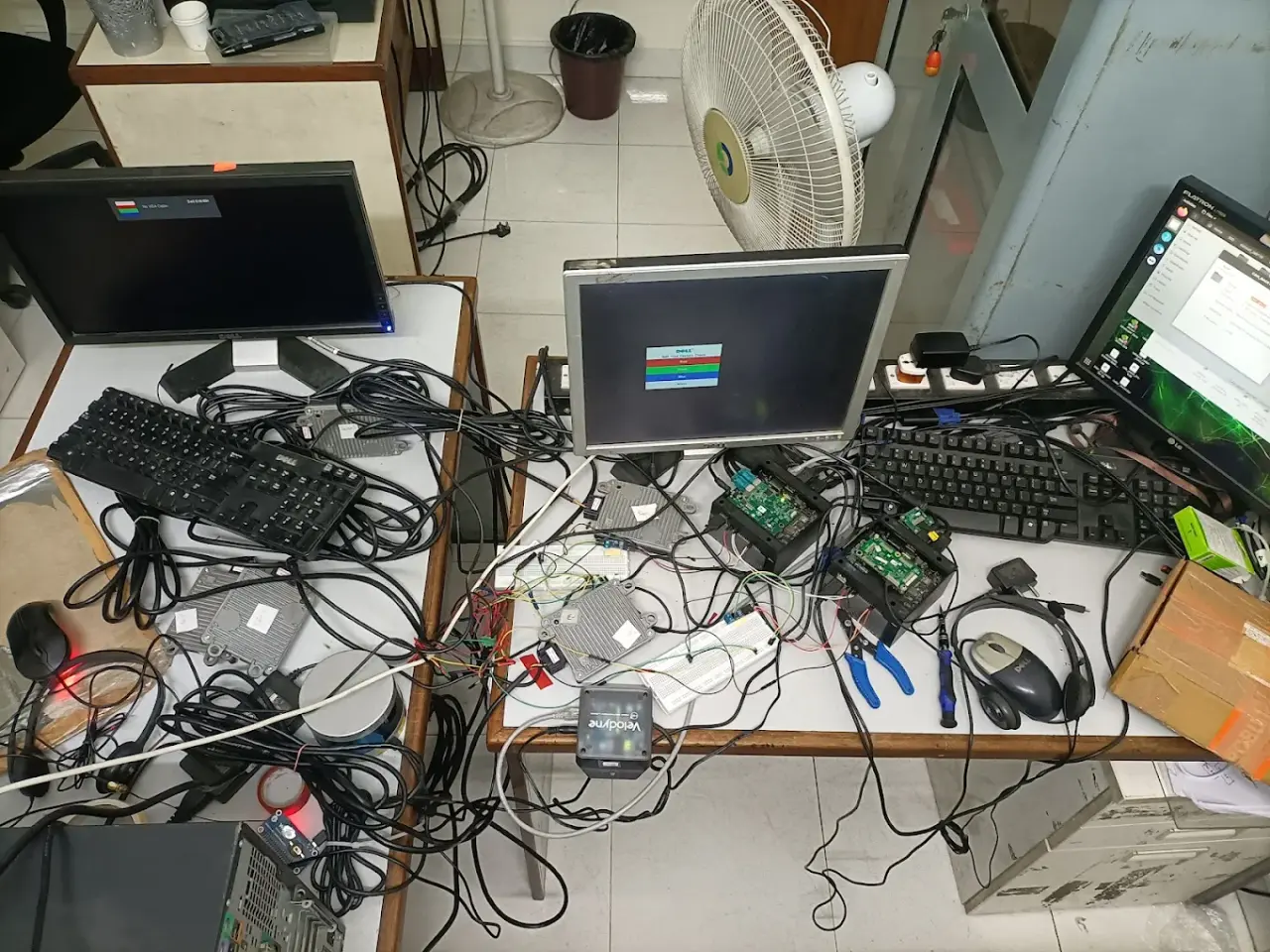 Technologics Global R&D bench with automotive ECUs, a Velodyne LiDAR unit and GPS hardware under development